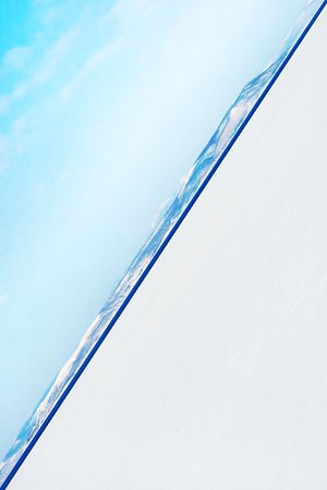 an ocean water horizon with a blue sky from an unusual angleの写真素材