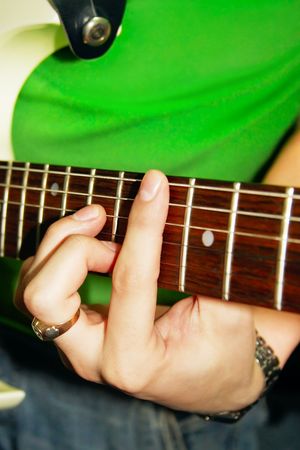 fingers of guitar player (shallow dof)