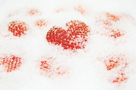 red hearts in the white snowの写真素材