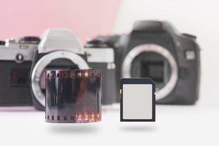 Soaring Memory Flash Card and 35 mm Negative Film Roll with DSLR on Backの写真素材