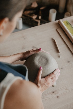 Young Women molded ceramic plate from clay