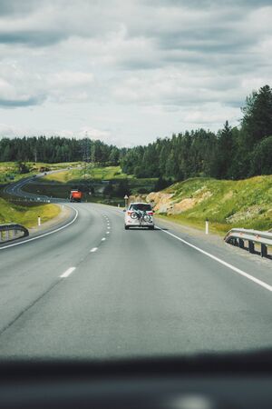 Car driving on winding road for new adventures pov