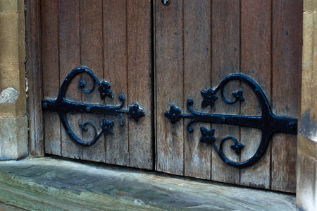 stylish wooden gate with black hingesの写真素材