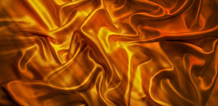 Pattern on the gold-colored satin fabric の写真素材