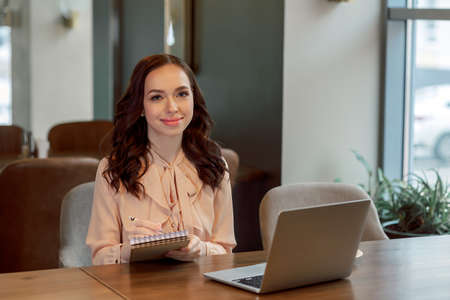Portrait of a business woman in a cafe.