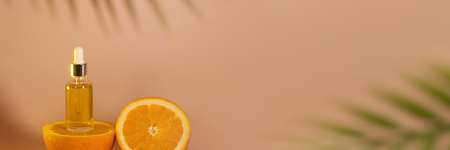 Banner front view of amber colored essential oil bottle.の写真素材