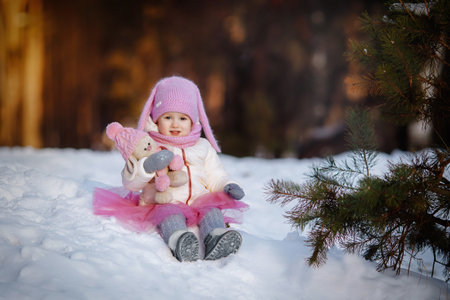 Charming little girl in a warm coat.の写真素材