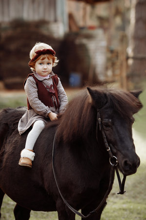 A girl rides a horseの写真素材