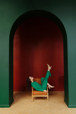 Girl posing on a chairの写真素材