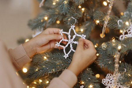 Decorated Christmas tree on blurred background.