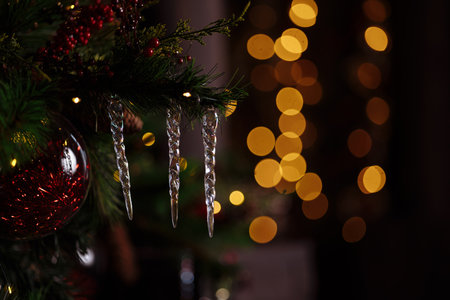 Decorated branch of a Christmas tree on a blurred background.の写真素材