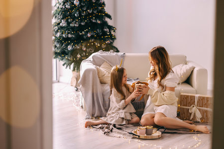 Daughter gives mom a gift.の写真素材