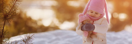 Banner charming little girl in a warm coat.の写真素材