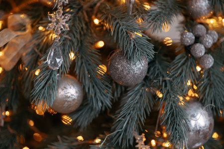 Close-up of a festively decorated outdoor Christmas treeの写真素材