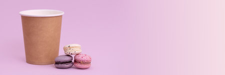 Banner macarons and brown paper cupの写真素材