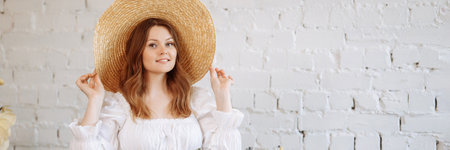 A young florist takes care of flowers in a cozy flower shopの写真素材