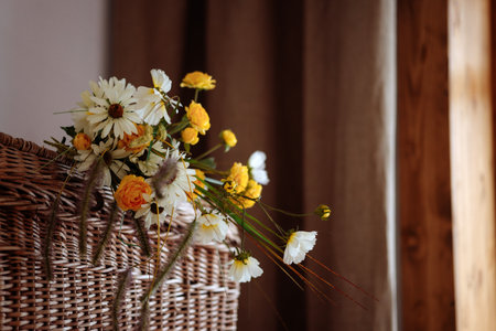 Wicker basket filled with wildflowers.の写真素材