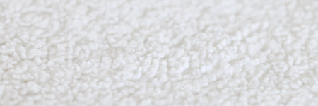 The texture of a white, soft, cozy carpet.の写真素材