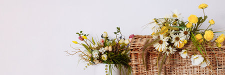 Wicker basket filled with wildflowers.の写真素材