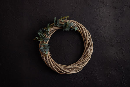 Round vine wreath on a dark backgroundの写真素材