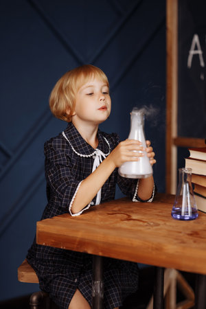 Schoolgirl doing a chemical experimentの写真素材
