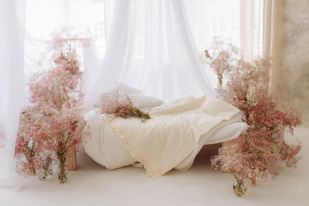 Elegant cozy bedroom in soft light colors.の写真素材