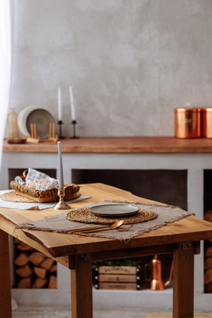 Authentic wooden table against a blurred rustic kitchen background.の写真素材