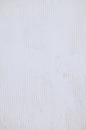 White vertical stripe plastered wall. Structural plaster on wallの写真素材