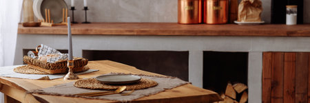 Authentic wooden table against a blurred rustic kitchen background.の写真素材