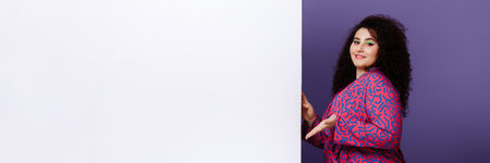 Plus size model woman gesturing to empty space for text.