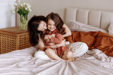 Happy loving family. Mother and her daughter child girl playing and hugging.の写真素材