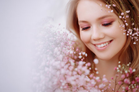 Close-up of a womans face with flowersの写真素材