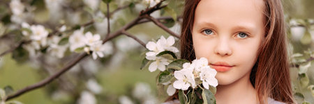 Girl in blooming apple orchardの写真素材