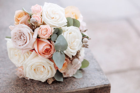 Wedding bouquet of roses on a stone surface