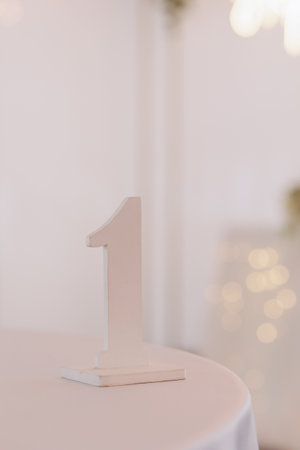 White Number One Decoration on Bright Table