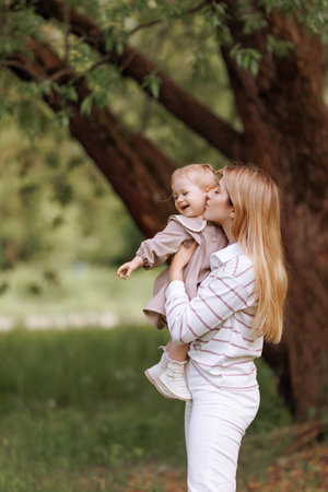 A joyful image of a mother and child in a parkの写真素材