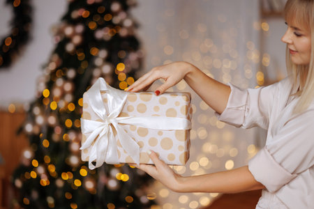 Gift in the hands of a woman for Christmas