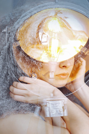 Abstract photo of a girl and retro spotlightの写真素材