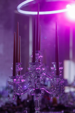 Crystal chandelier under purple light.の写真素材