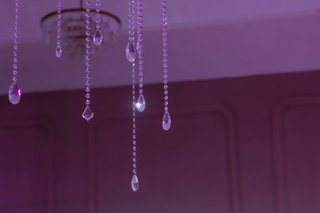 Crystal beads, purple light, hanging ceiling.の写真素材