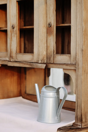 Vintage Wooden Cabinet, Silver Watering Canの写真素材