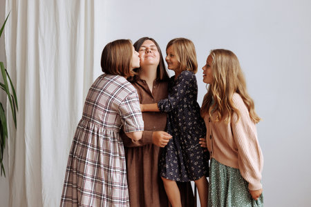 Four young girls in dresses of retro colors