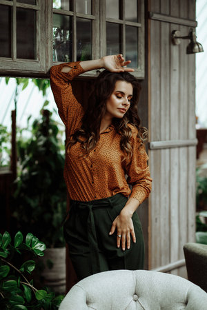 Caucasian woman enjoying coffee in a restaurant.の写真素材