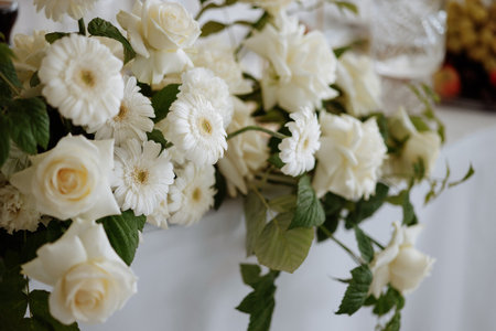 A bouquet of white roses and daisiesの写真素材