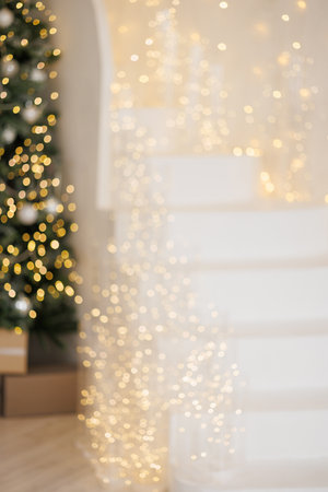 A white staircase leading up to a white Christmas treeの写真素材