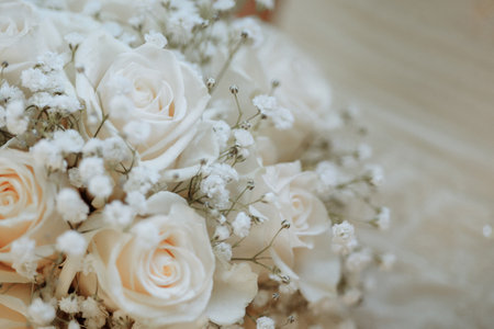 A wedding bouquet of white roses with babys breathの写真素材
