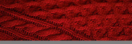 Banner a close up of a red knit sweater