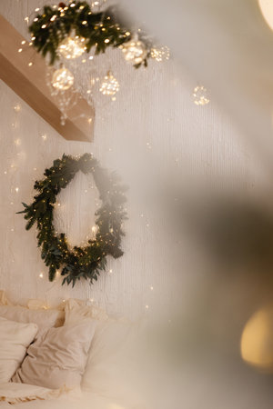 White wooden window frame with blurred warm lights in festive indoor settingの写真素材