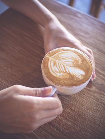 Cup of coffee latte in coffee shopの写真素材
