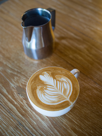 Cup of coffee latte in coffee shopの写真素材
